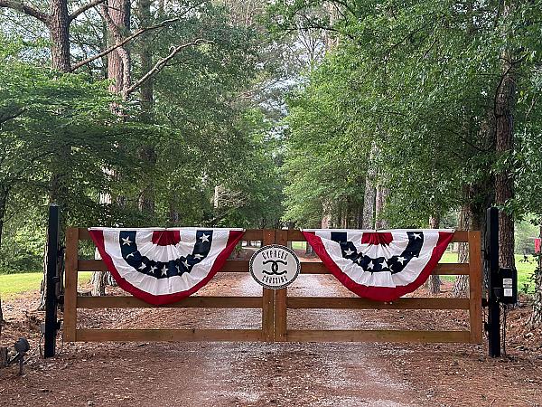 flags on gate for Cypress Crossing
