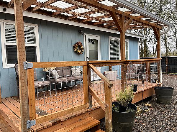 blue house with bright covered deck