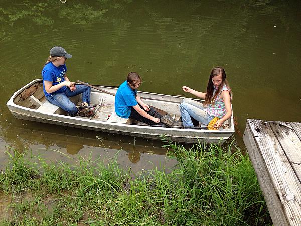 people in a boat doing some fishing