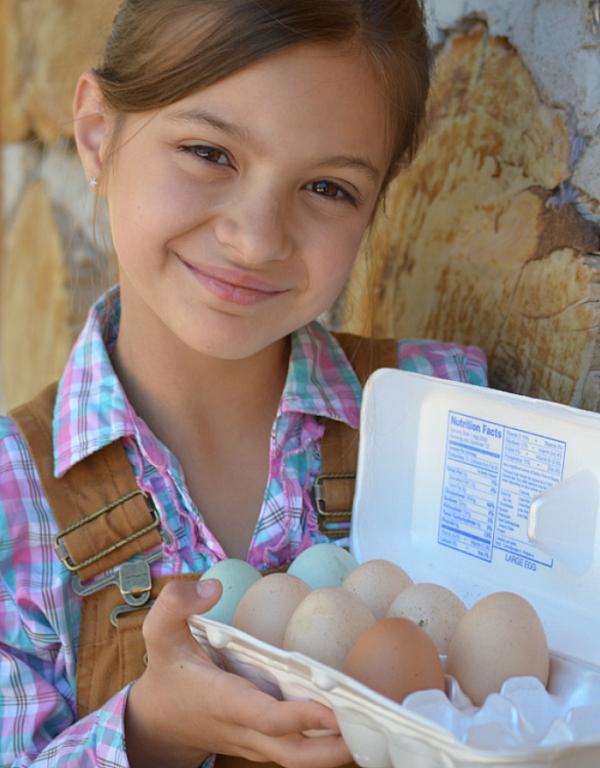 a girl with fresh eggs