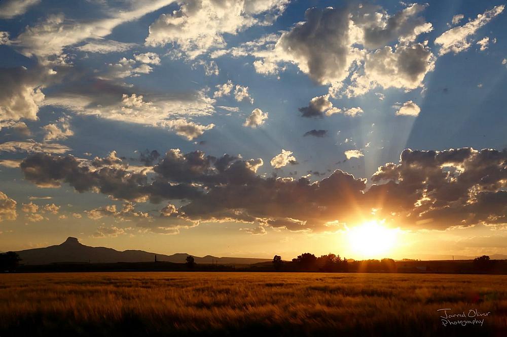 Featured Image - sunset over plains with dark clouds