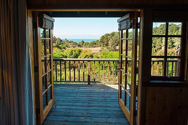 Looking out through French doors towards the sea in Mendocino CA