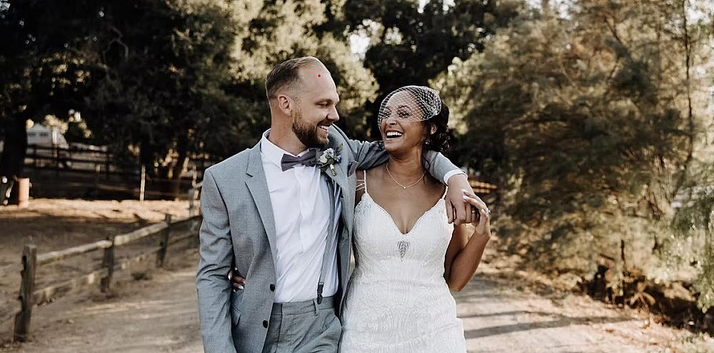 Featured Image- Just married couple walking down a farm lane