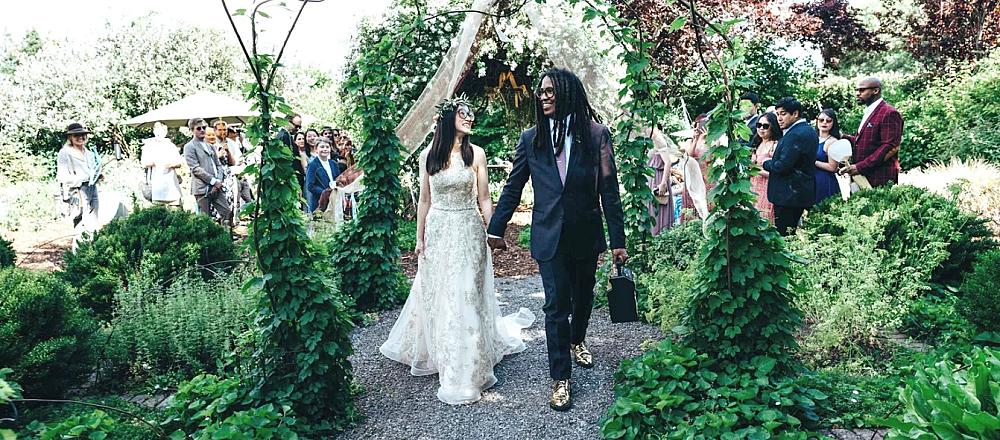 Featured Image- Couple get married on the farm in the garden with family and friends surrounding them
