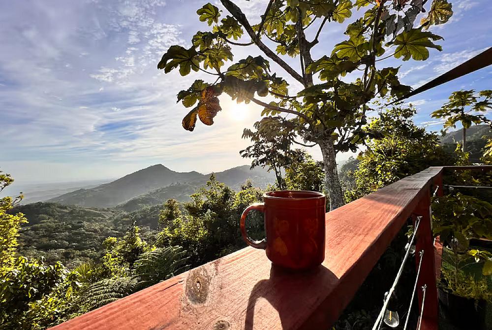 Featured Image - coffee cup on deck sill looking out over countryside