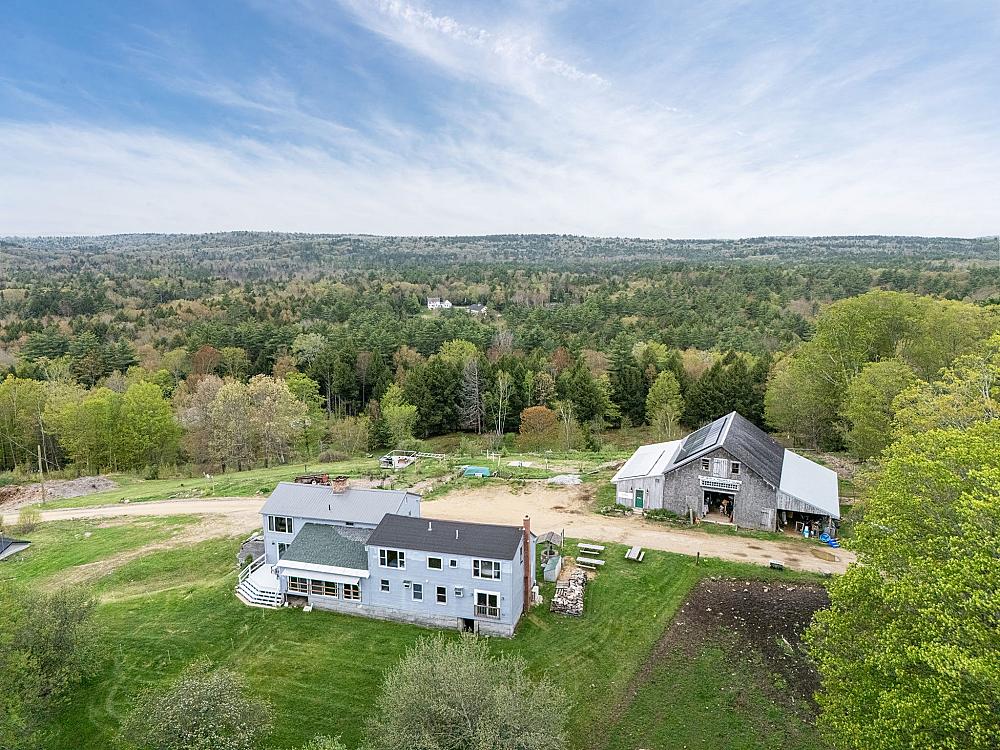 Miles Smith Farm is a magical hilltop farmhouse getaway where stressed-out travelers come to trade frustration for fresh air, panoramic pasture views, and the company of Scottish Highland cattle.