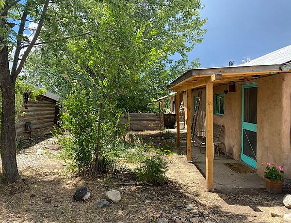 stucco house with blue door