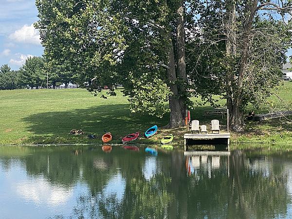 pond with dock and kayaks