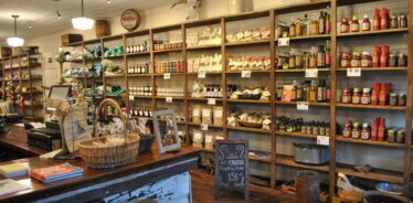 a store stocked with goods on the shelves