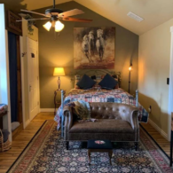 The bunkhouse bedroom/bathroom/tile shower/claw foot bathtub