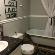 The farmhouse guest bathroom and claw foot tub