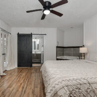 1 of 4 bedrooms in the lodge. King bed with full bat and TV!